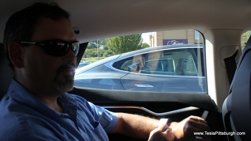 looking through rear windows of head to head comparison with light harmonics labs speakers tesla pittsburgh