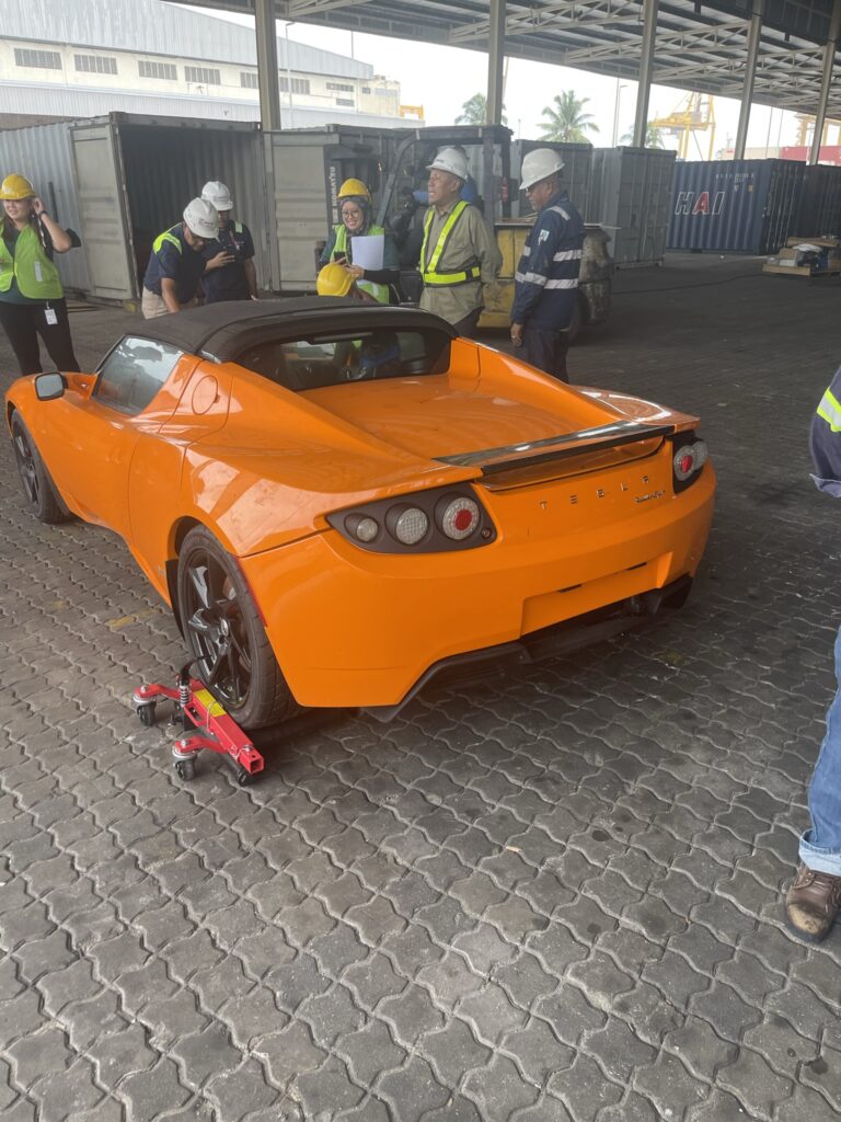 tesla abandoned roadster removed from crate in china